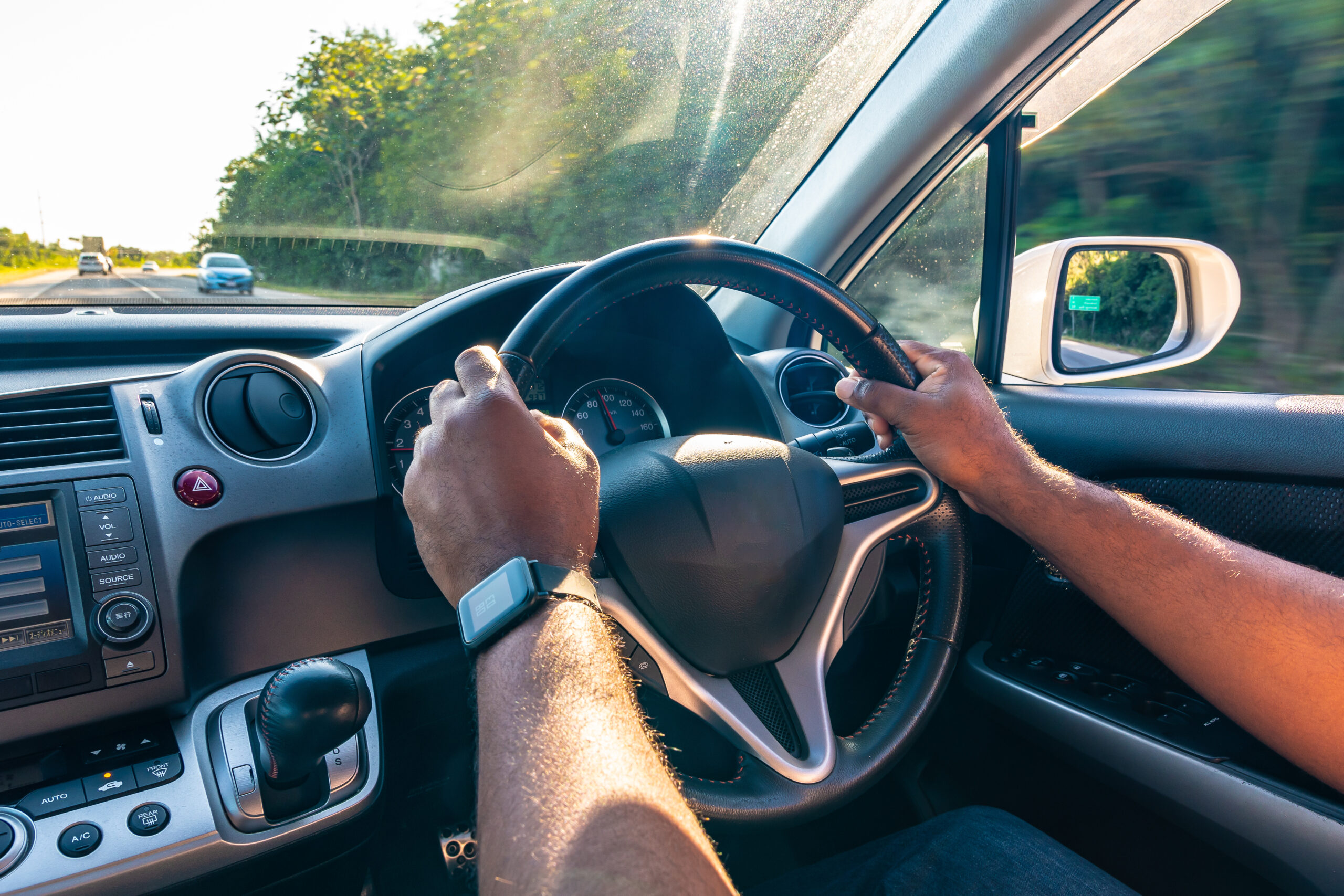 Both,Hands,Of,Young,Black,Adult,Male,On,Steering,Wheel
